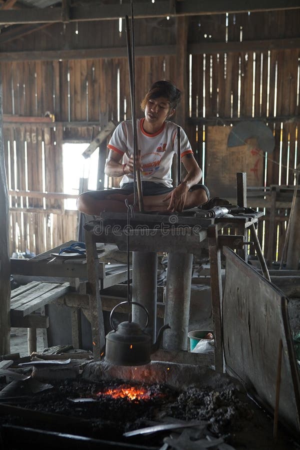 Burmese man is boiling a water for the tea Myanmar royalty free stock photo Burmese man is boiling a water for the tea Myanmar royalty free stock photo