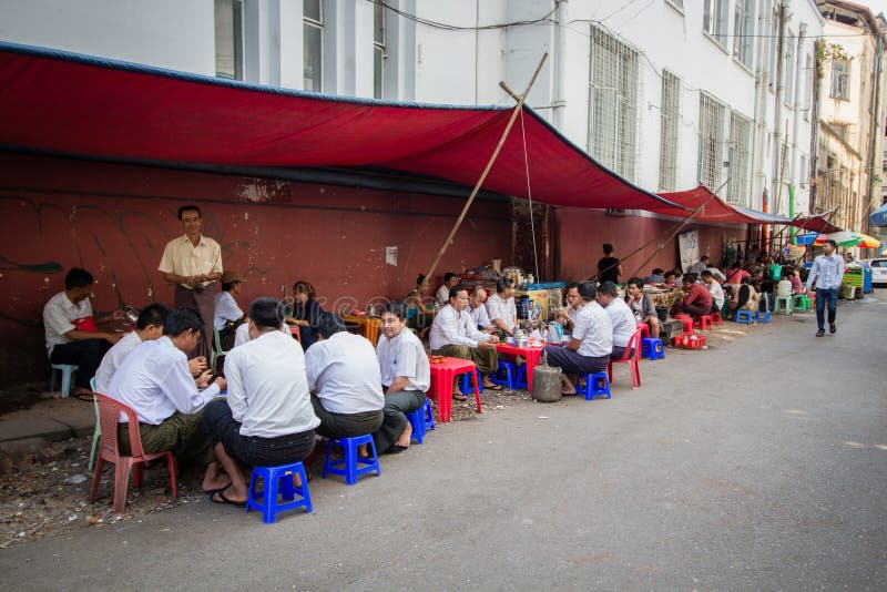 Burmese people eating food and drinking tea on the street vendor