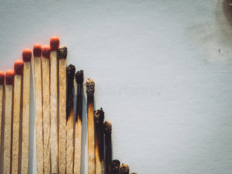Burned matchsticks. abstract concept of stock market crash, flat lay