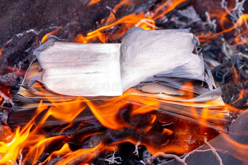 Burning book. The Inquisition burns illicit books