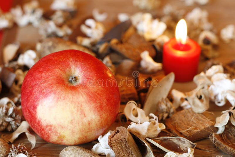 Burning candle, Apple and Dried Plants