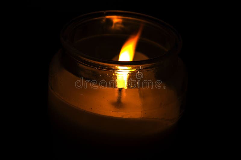 Burning candle in the dark stock photo. Image of departed 198765106