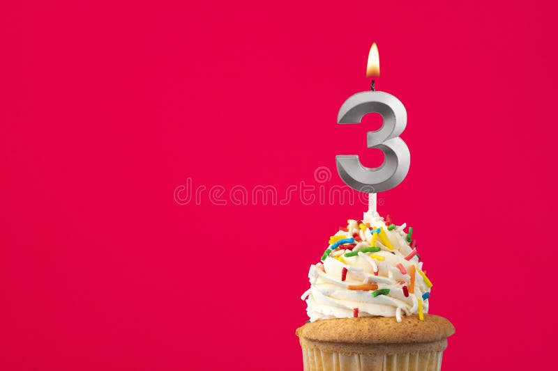 Burning candle number 3 - Birthday card with cake stock photo