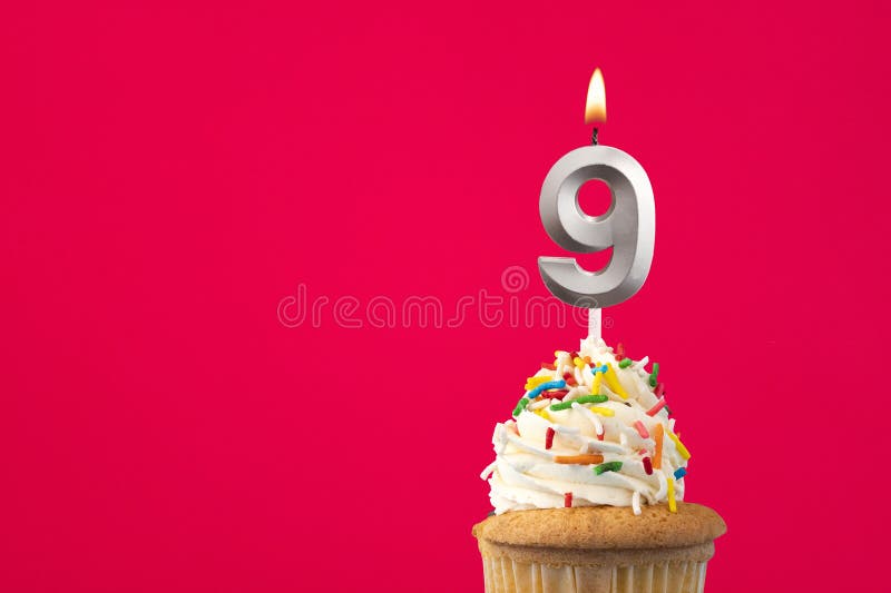 Burning candle number 9 - Birthday card with cake royalty free stock photography