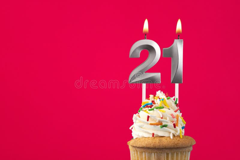 Burning candle number 21 - Birthday card with cake stock photo