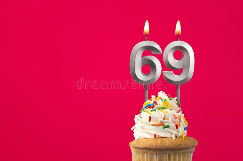 Burning candle number 69 - Birthday card with cake stock image