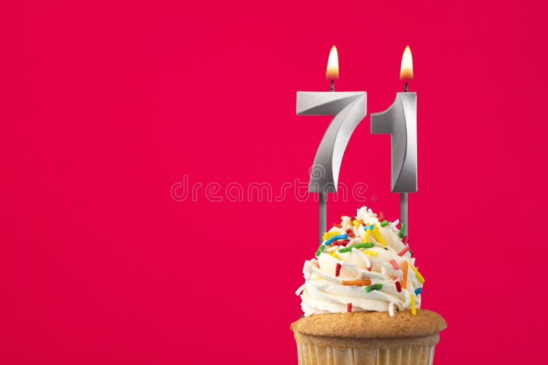 Burning candle number 71 - Birthday card with cake royalty free stock photo