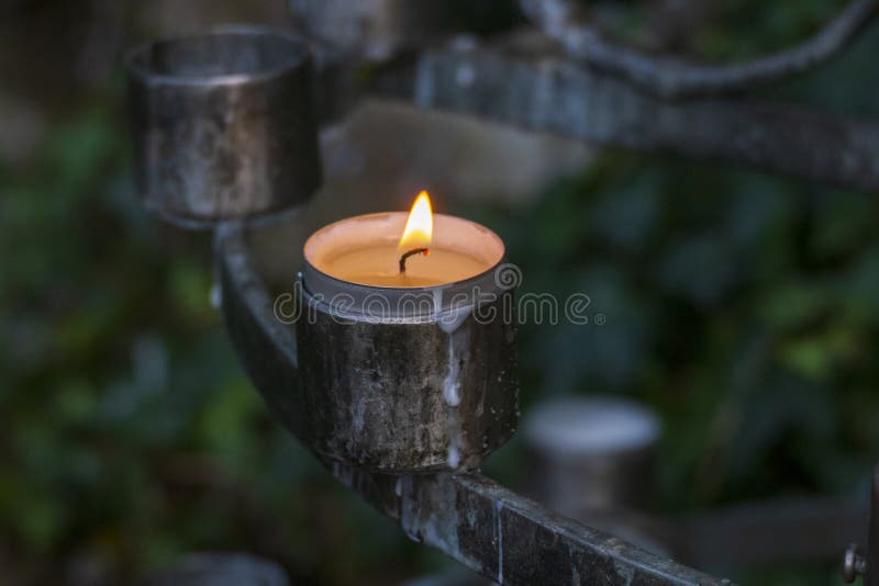Burning Candle, Tea Light in a Church, Symbol of Intercession Stock
