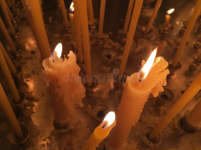 Burning Candles during Epiphany at Russian Orthodox Church. Stock Photo
