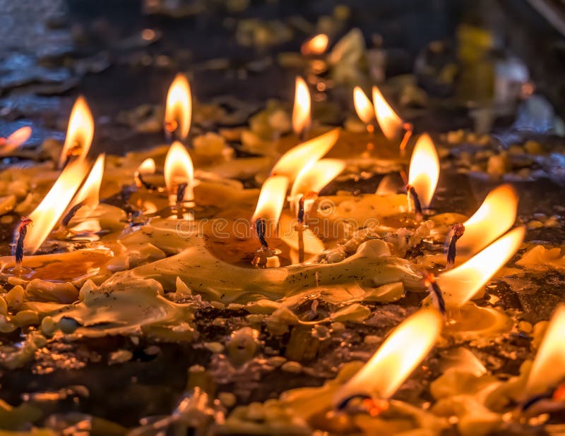 Burning Candles in Memory of the Dead. Melted Wax from Candles Stock