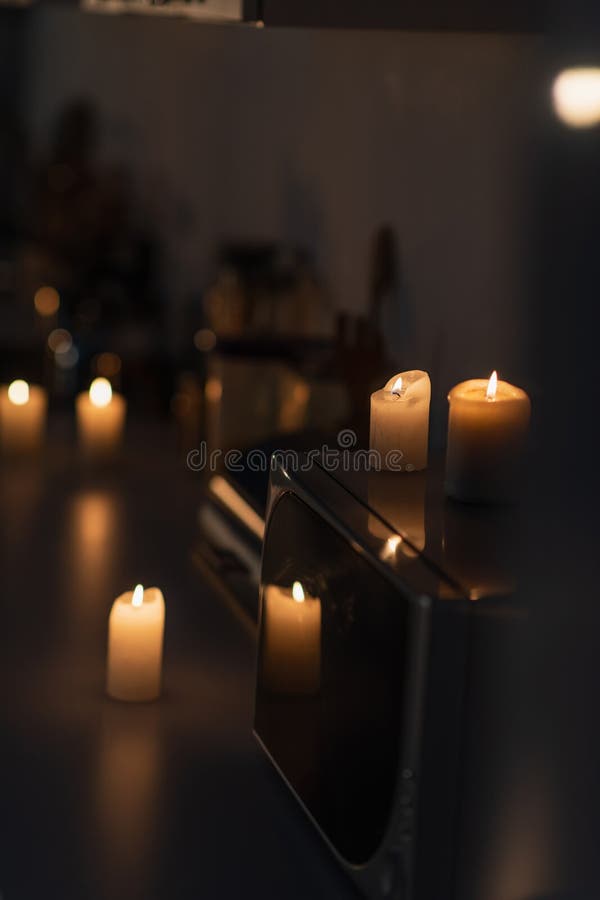 Burning Candles on Microwave Oven and Stock Photo Image of kitchen