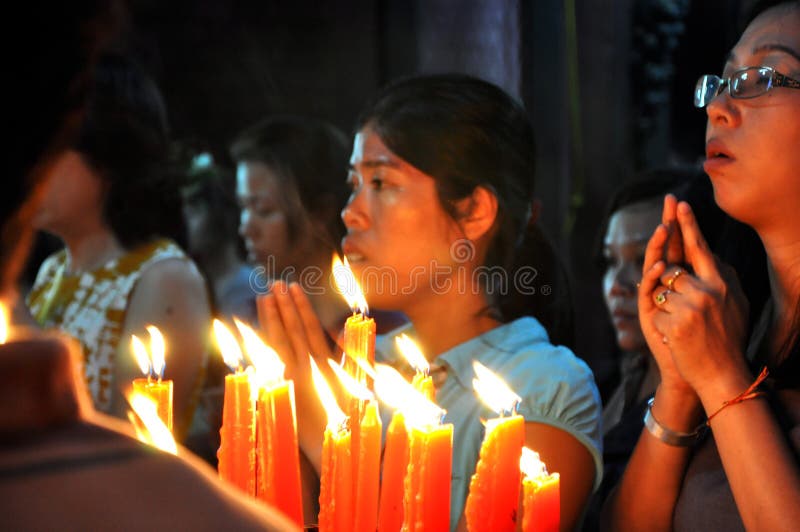 Burning candles and praying people in a Vietnamese pagoda royalty free stock photos Burning candles and praying people in a Vietnamese pagoda royalty free stock photos