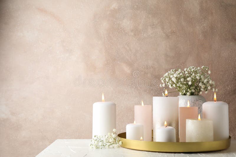 Burning candles, tray and flower on table, space for text royalty free stock photos