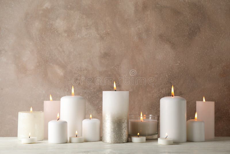 Burning candles on white wooden table against background, space for text royalty free stock photos
