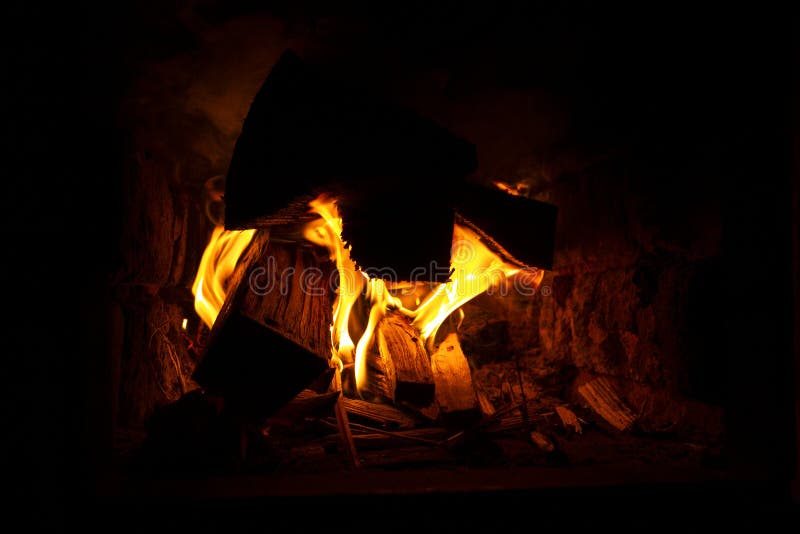 Burning Firewood in the Oven Closeup, Cozy Warmth by the Fireplace