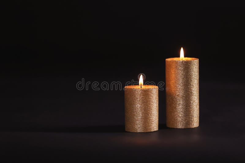 Burning Gold Candles on Black Background Stock Photo Image of beeswax, gold 149453908