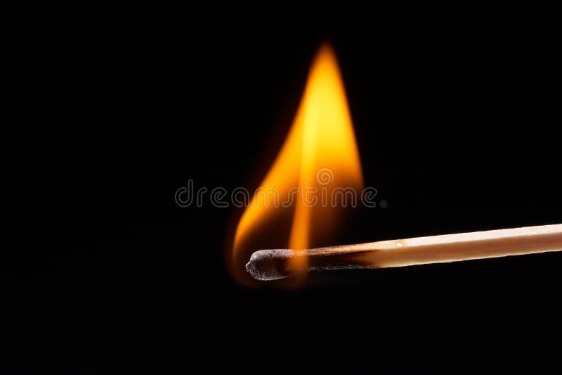 Burning, flaming match on black background - landscape format. Burning, flaming match on black background - landscape format