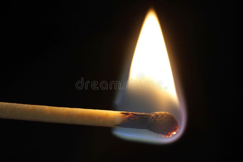 Photo of a burning Match on black background