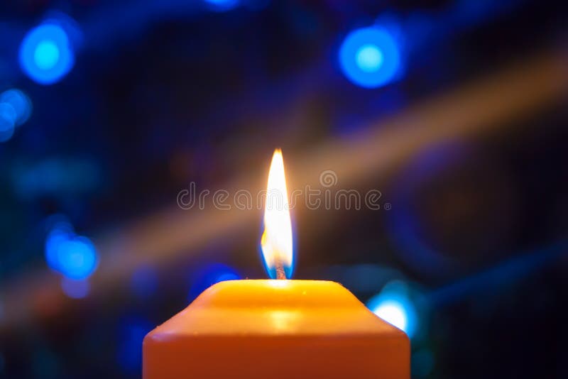A Burning Orange Candle on a Dark Background with Blue Lights - a Christmas  New Year`s Eve Divination Mystic Esoteric Romance Lov Stock Photo - Image  of horizontal, christmas: 176384868