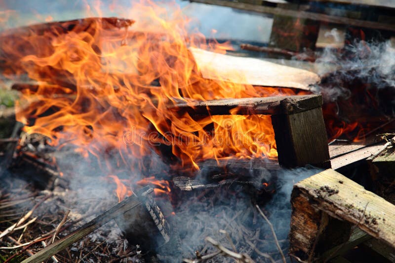 Burning pallets and garden waste on an allotment royalty free stock images