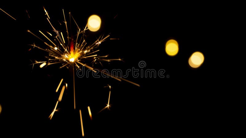 burning sparkler on bokeh background from lights of garland stock photography burning sparkler on bokeh background from lights of garland stock photography
