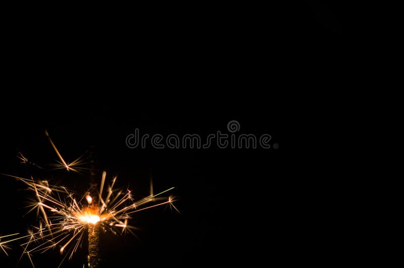 Sparkler in Yellow and Orange Light on a Black Background Stock Photo -  Image of light, color: 167471280