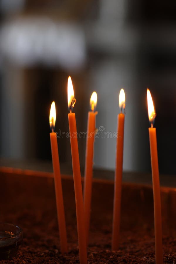 Burning votive candles stock image. Image of cathedrals 16545031