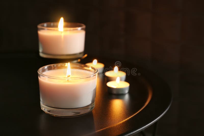 Burning Wax Candles on Table in Darkness Stock Image Image of style
