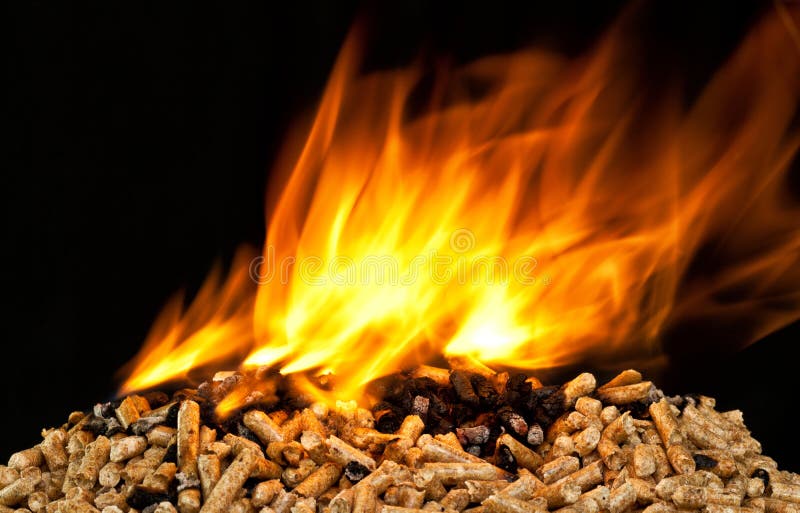 Burning wood pellet stock image. Image of fire, cylinder 76835701