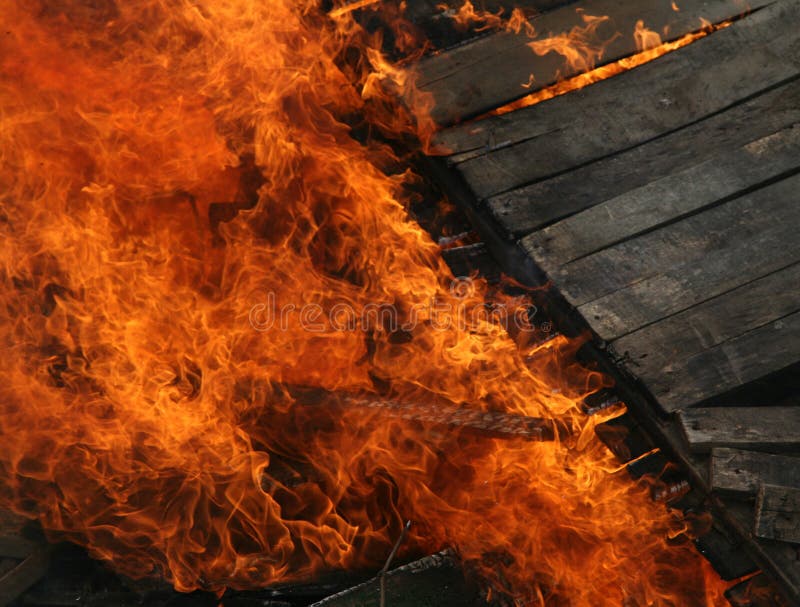Burning wooden house. Close-up