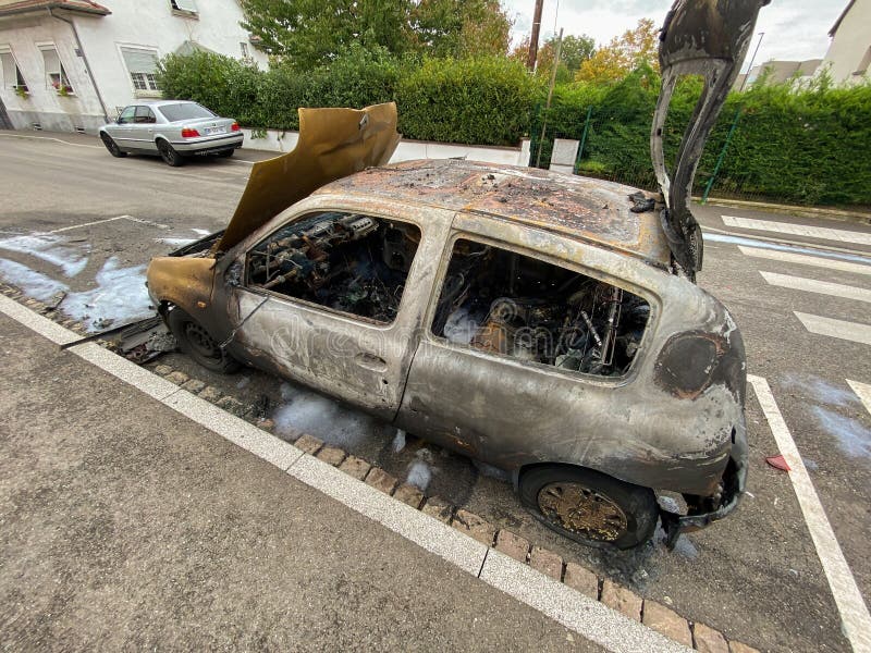 Burnt Renault Mini Car on the Street of Strasbourg in Bad Neighborhood ...