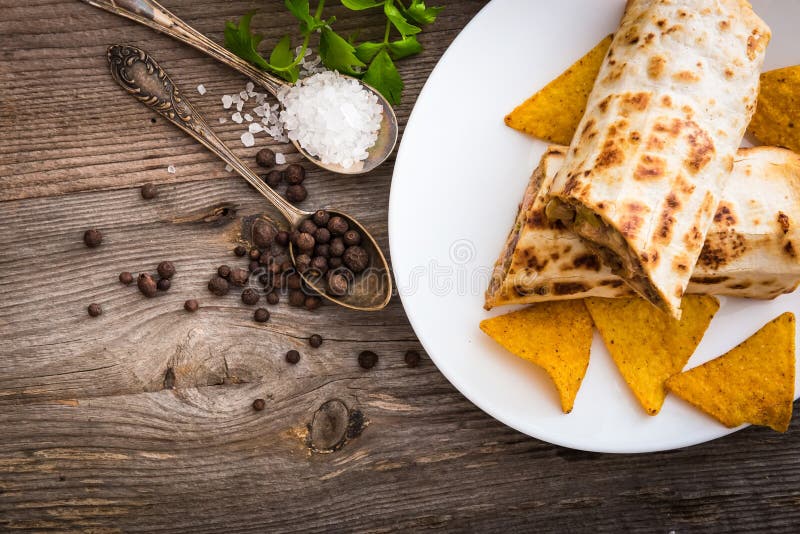 Burrito with chips stock image. Image of golden, sprig 59596279
