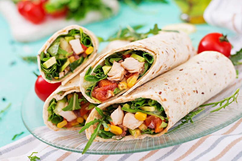 Burritos Wraps with Chicken and Vegetables on Light Background. Stock
