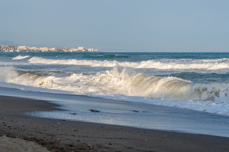 Rough seas during a storm, seen from Fuengirola beach, Costa del Sol, Andalusia, southern Spain. Rough seas during a storm, seen from Fuengirola beach, Costa del Sol, Andalusia, southern Spain