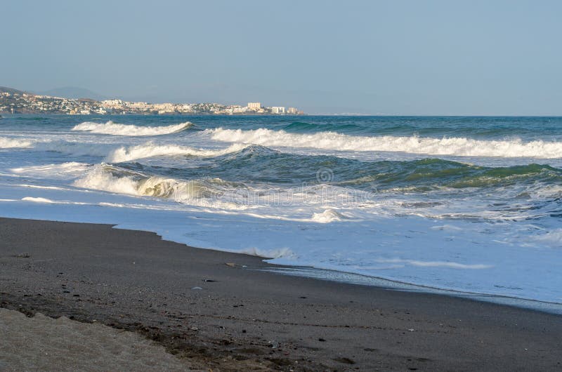 Rough seas during a storm, seen from Fuengirola beach, Costa del Sol, Andalusia, southern Spain. Rough seas during a storm, seen from Fuengirola beach, Costa del Sol, Andalusia, southern Spain