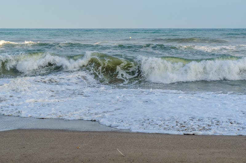 Rough seas during a storm, seen from Fuengirola beach, Costa del Sol, Andalusia, southern Spain. Rough seas during a storm, seen from Fuengirola beach, Costa del Sol, Andalusia, southern Spain