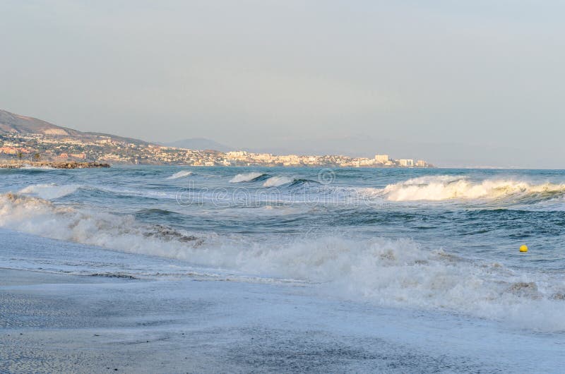 Rough seas during a storm, seen from Fuengirola beach, Costa del Sol, Andalusia, southern Spain. Rough seas during a storm, seen from Fuengirola beach, Costa del Sol, Andalusia, southern Spain