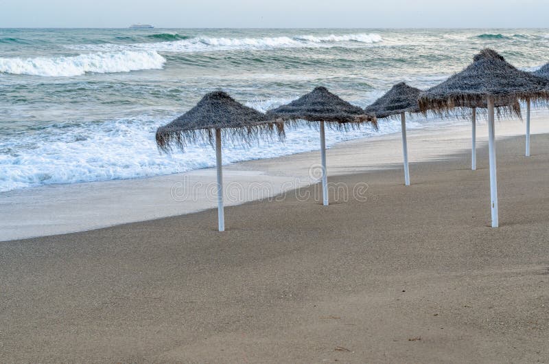 Rough seas during a storm, seen from Fuengirola beach, Costa del Sol, Andalusia, southern Spain. Rough seas during a storm, seen from Fuengirola beach, Costa del Sol, Andalusia, southern Spain