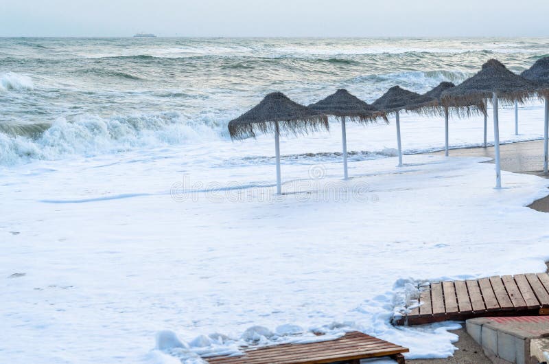 Rough seas during a storm, seen from Fuengirola beach, Costa del Sol, Andalusia, southern Spain. Rough seas during a storm, seen from Fuengirola beach, Costa del Sol, Andalusia, southern Spain