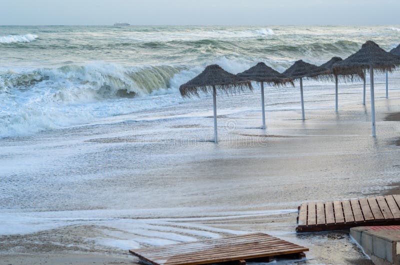 Rough seas during a storm, seen from Fuengirola beach, Costa del Sol, Andalusia, southern Spain. Rough seas during a storm, seen from Fuengirola beach, Costa del Sol, Andalusia, southern Spain