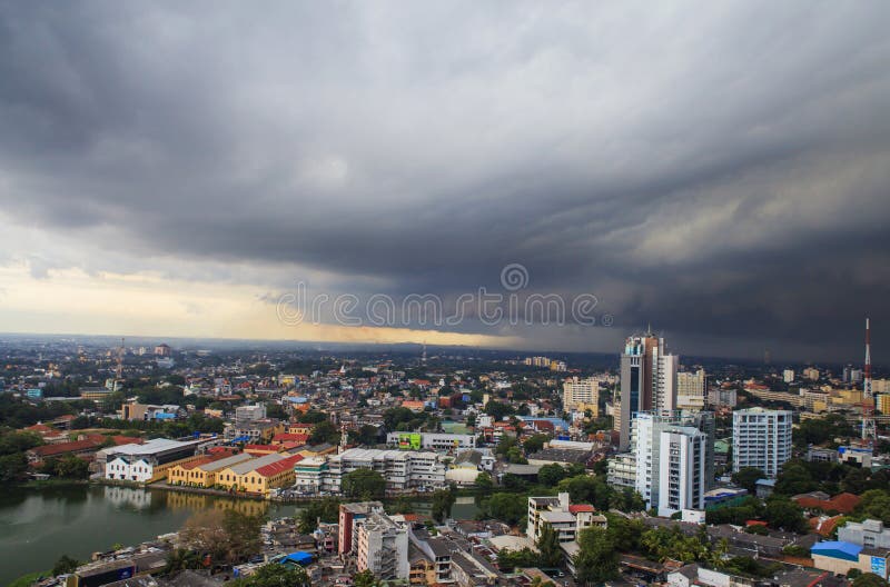 Stormy weather with rain on the beach. Last sun rays just a few minutes before powerful thunderstorm in Colombo, Sri Lanka. Stormy weather with rain on the beach. Last sun rays just a few minutes before powerful thunderstorm in Colombo, Sri Lanka