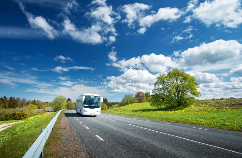 Bus on asphalt road in beautiful spring day stock images Bus on asphalt road in beautiful spring day stock images