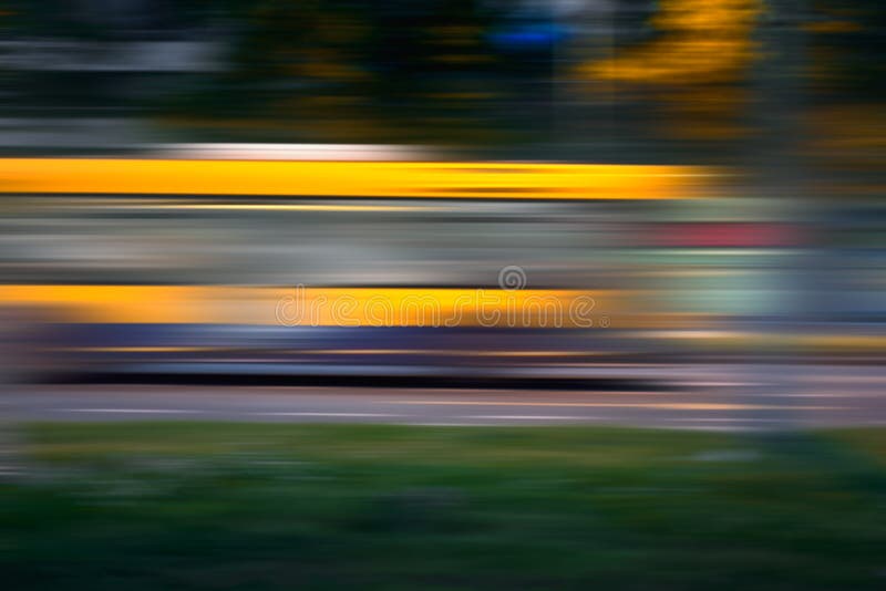 Bus in motion blur on street at night