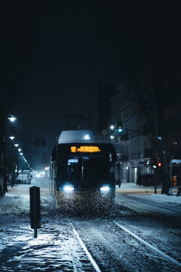 Bus Traveling Down a Snowcovered Road at Night Editorial Stock Photo Image of moonlit