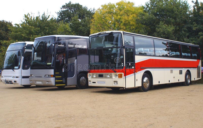 Buses. coaches. buses or coaches parked in a car park. Tourists buses or coaches parked in a car park royalty free stock photography Buses. coaches. buses or coaches parked in a car park. Tourists buses or coaches parked in a car park royalty free stock photography