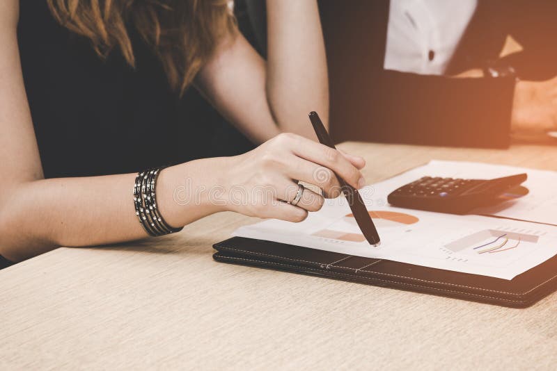 Business adviser analyzing and discussing financial figures denoting the progress in the work of the company. royalty free stock photo Business adviser analyzing and discussing financial figures denoting the progress in the work of the company. royalty free stock photo
