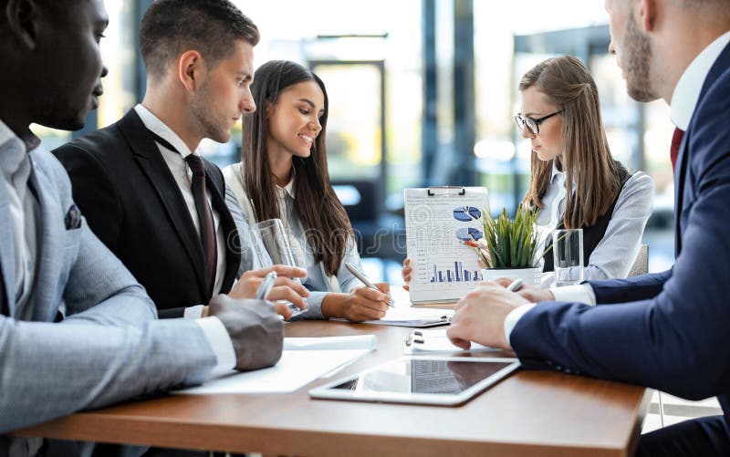 Business adviser analyzing financial figures denoting the progress in work of company royalty-vrije stock afbeelding