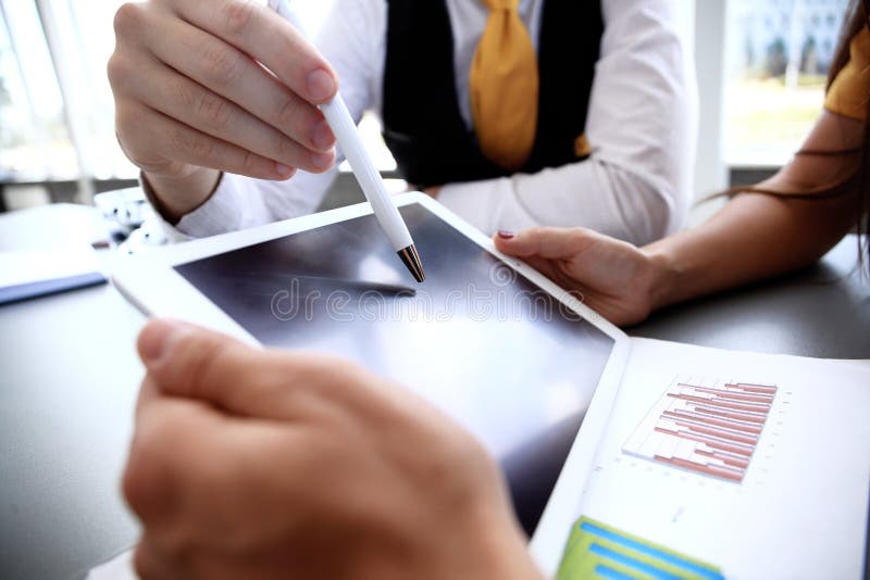 Business adviser analyzing financial figures denoting the progress in the work of company stock photos Business adviser analyzing financial figures denoting the progress in the work of company stock photos