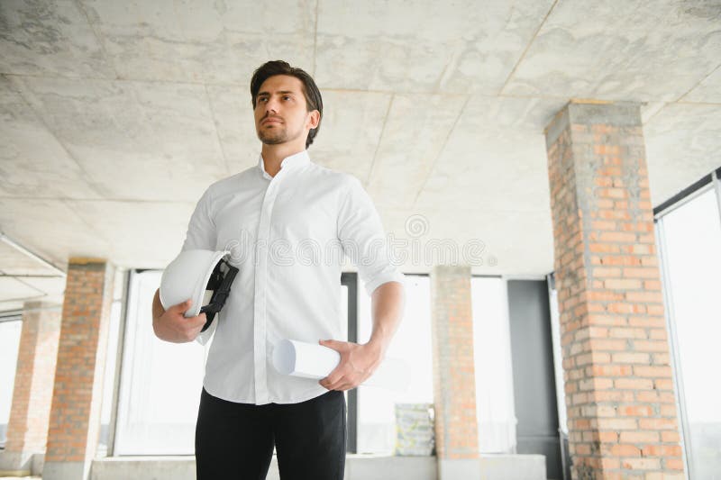 Business architect man wearing hardhat standing of a building project stock photos