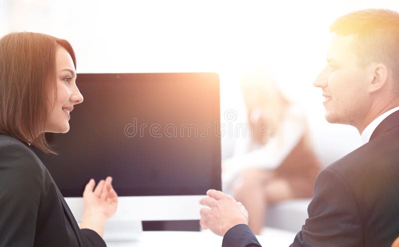 Business associates talking at a Desk. stock photos Business associates talking at a Desk. stock photos